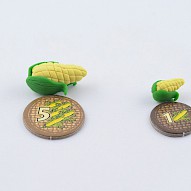 handmade corn tokens next to original tokens from the game