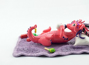 Playful pink baby dragon