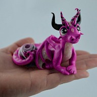 pink dragon with a gem