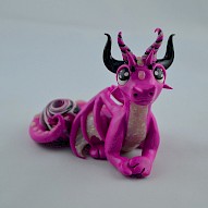 pink dragon with a gem